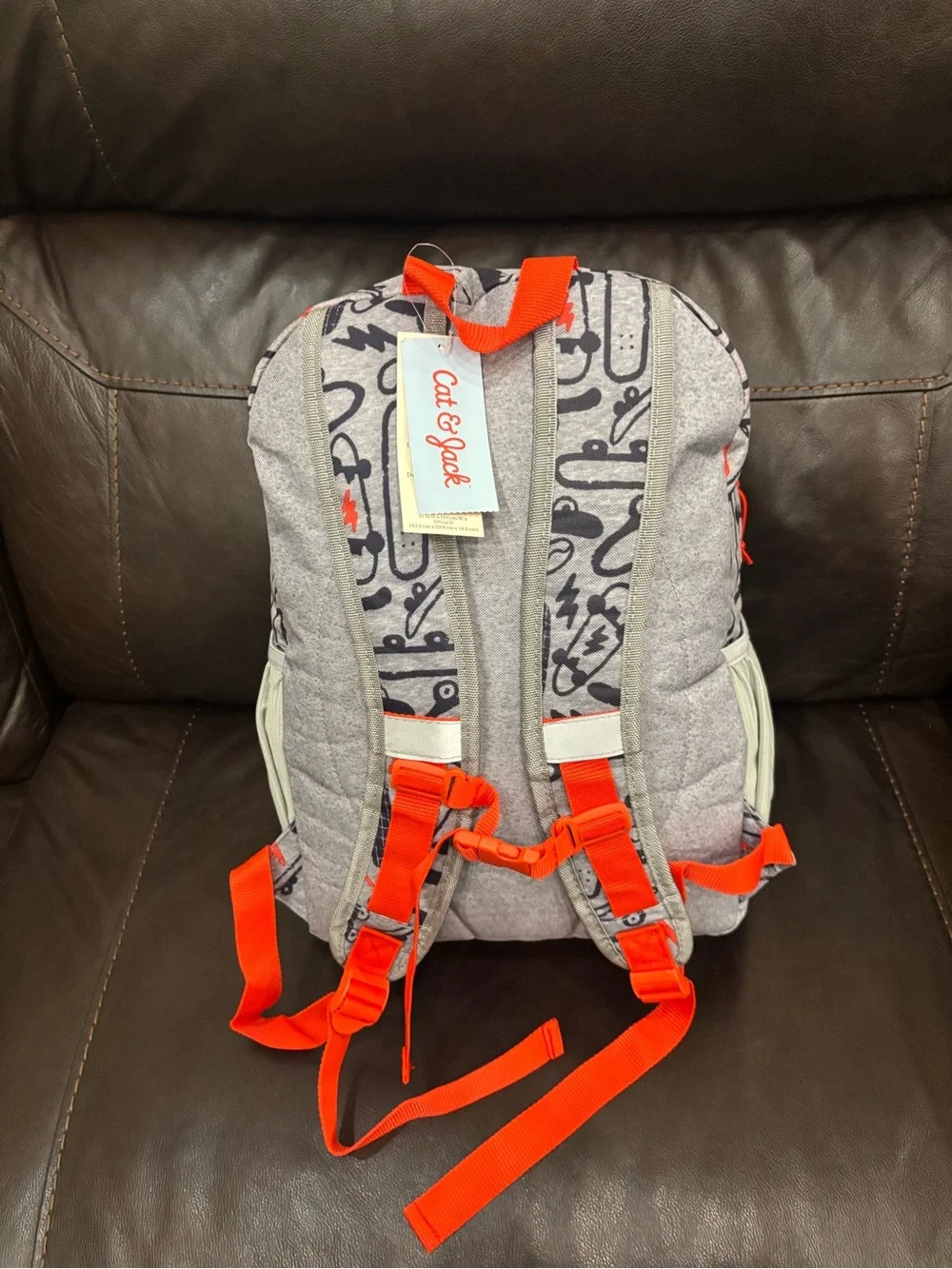 New with tags Kids Skateboard Print Backpack in Gray with Orange Accents
